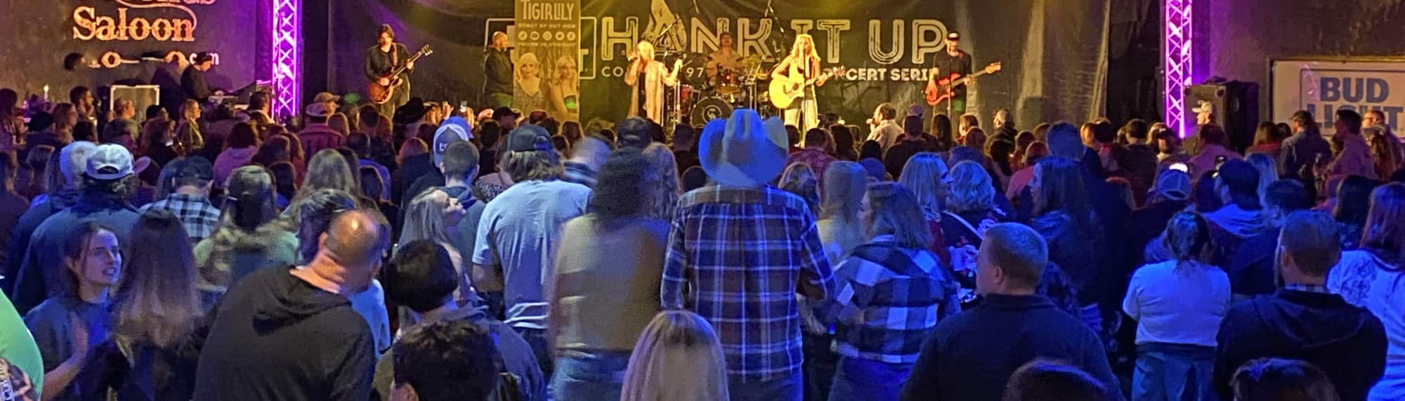 country concert with fans wearing cowboy hats Roanoke