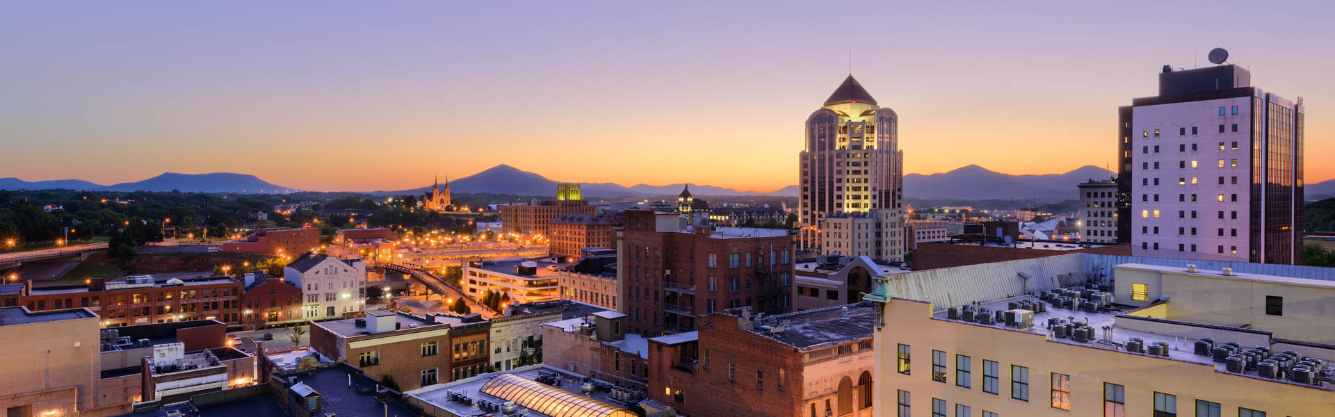 Neon color image of a band playing and people singing along